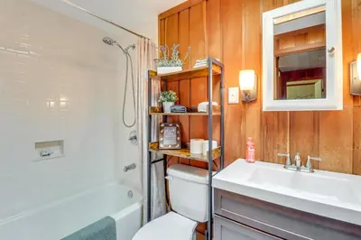 a bathroom with a toilet and a sink and a shower at Swim Dock and Game Room Lakefront Poconos Cabin! in Long Pond