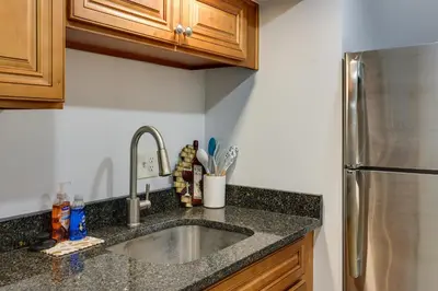 a kitchen with a sink and a stainless steel refrigerator at Quakertown Vacation Rental Close to Hiking Trails in Quakertown