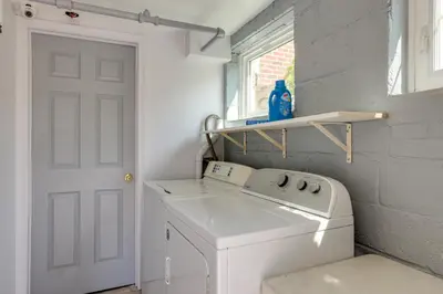 a white laundry room with a washing machine and a window at Quakertown Vacation Rental Close to Hiking Trails in Quakertown