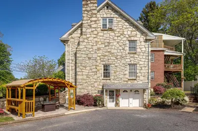 a stone house with a gazebo in front of it at Quakertown Vacation Rental Close to Hiking Trails in Quakertown