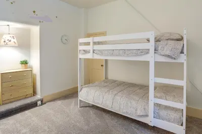 a bedroom with two bunk beds in a room at Walk to Restaurants and Shops Apt in Pennsylvania! in Pottstown