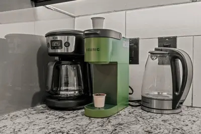 a coffee maker sitting on top of a counter at StayRafa At 261 4R in Philadelphia