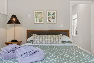 a bedroom with a bed with towels on it at StayRafa At 261 4R in Philadelphia