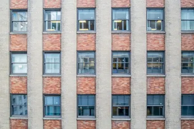 a facade of a brick building with windows at FiDi 1br w gym doorman wd nr Wall St NYC-983 in New York