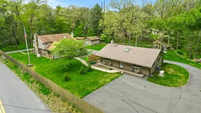 an aerial view of a house with a yard at 2 Houses, 22+Guests, 2 Hot Tubs, Renovated, Events Welcome! in Hawley