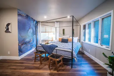 a bedroom with a bed with a canopy at 2 Houses, 22+Guests, 2 Hot Tubs, Renovated, Events Welcome! in Hawley