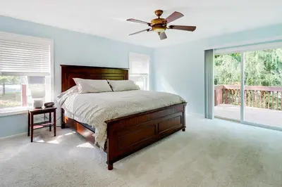 a bedroom with a bed and a ceiling fan at Huge Deck Stunning Pocono Lake Vacation Rental! in Pocono Lake