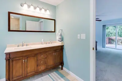 a bathroom with a sink and a mirror at Huge Deck Stunning Pocono Lake Vacation Rental! in Pocono Lake