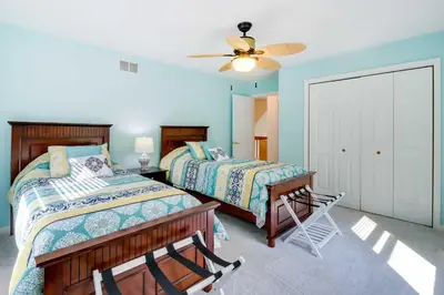 a bedroom with two beds and a ceiling fan at Huge Deck Stunning Pocono Lake Vacation Rental! in Pocono Lake