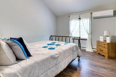 a bedroom with a bed and a dresser and a window at Exciting Tobyhanna Home Near Kalahari Water Park! in Tobyhanna