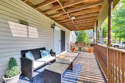a porch with a couch and a table at Exciting Tobyhanna Home Near Kalahari Water Park! in Tobyhanna