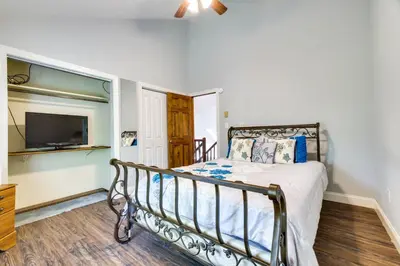 a bedroom with a bed and a flat screen tv at Exciting Tobyhanna Home Near Kalahari Water Park! in Tobyhanna