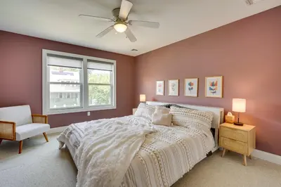 a bedroom with a bed and a ceiling fan at Gorgeous Keansburg Home with Pool Walk to Beach! in Keansburg