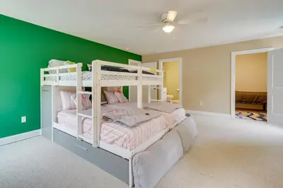 a bedroom with green walls and a bunk bed at Gorgeous Keansburg Home with Pool Walk to Beach! in Keansburg