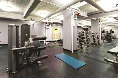 a gym with treadmills and machines in a room at UWS 1BR w Gym WD Doorman nr Central Park NYC-377 in New York