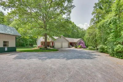 a driveway with a house and a tree at The Haven at Welsh Mountain Suites - Apt with Patio! in New Holland