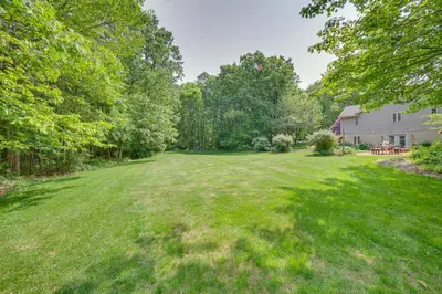a large yard with trees and a house at The Haven at Welsh Mountain Suites - Apt with Patio! in New Holland