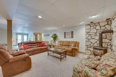 a living room with two couches and a fireplace at The Haven at Welsh Mountain Suites - Apt with Patio! in New Holland