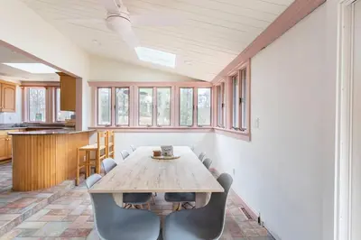 a dining room with a table and chairs at The country house in Greenwood Lake