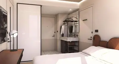 a bedroom with a bed and a mirror and a sink at Motto By Hilton New York City Times Square in New York