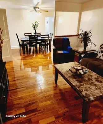 a living room with a couch and a table at Cozy 1 Bedroom Business Suite in Philadelphia