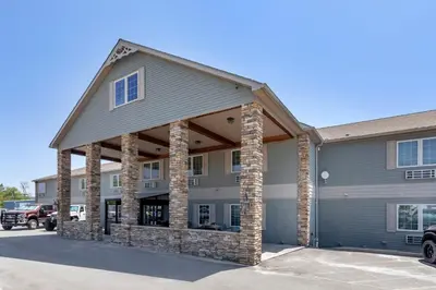 an exterior view of a building with a garage at The Riverstone Inn in Towanda