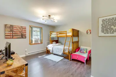 a bedroom with a bunk bed and a desk at Private Hot Tub and Fire Pit Pocono Lake House! in Pocono Lake