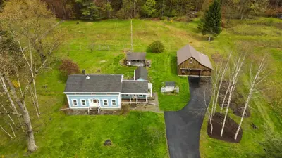 an aerial view of a house on a road at The Tannery House in Claryville