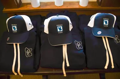 three hats are lined up on a shelf at Chestnut Inn at Oquaga Lake in Deposit