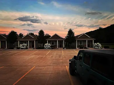 a car parked in a parking lot in front of a house at Vista Lodge Benton PA near Ricketts Glen State Park in Benton