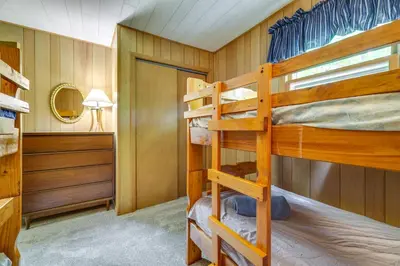 a bunk bed room with two bunk beds at Pet-Friendly Pocono Lake Cabin with Community Pool! in Pocono Lake