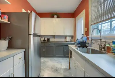 a kitchen with a refrigerator and a sink at Charming Downtown Retreat Steps from Capitol Bldg in Harrisburg