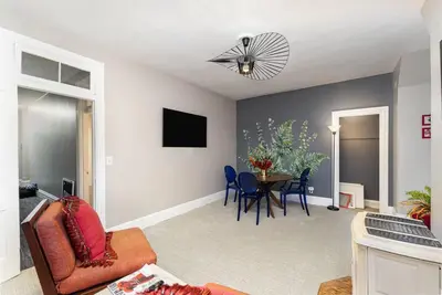 a living room with a couch and a table at Stylish Private 2 Bed Apt in Harrisburg