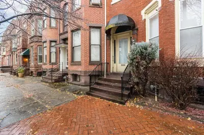 a group of houses on a brick street at Stylish Private 2 Bed Apt in Harrisburg