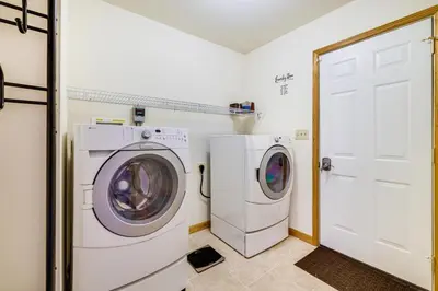 a laundry room with a washer and dryer at Deck and Screened Porch Pocono Lake Vacation Rental in Pocono Lake
