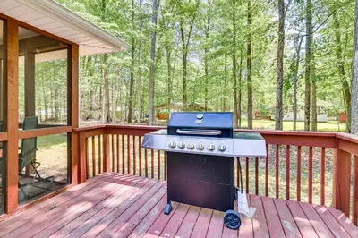 a grill sitting on a deck on a porch at Deck and Screened Porch Pocono Lake Vacation Rental in Pocono Lake