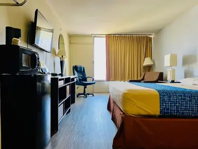 a hotel room with a bed and a television at Travelodge by Wyndham Carlisle North in Carlisle