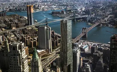 an aerial view of a city with a bridge at FiDi Studio w Gym Lounge Complete Gym NYC-499 in New York