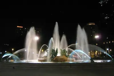 a group of water fountains in a city at night at Full bed studio near Temple and Center city Philadelphia in Philadelphia
