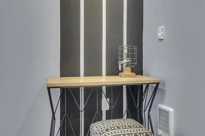 a table with a bird cage on top of it at Fairmount Art Museum Center City Suites in Philadelphia