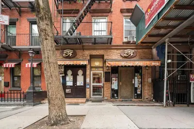 a building on the corner of a city street at Elevate Apartment at Times Square - Cozy Studio in Times Square and Nearby Restaurants in New York