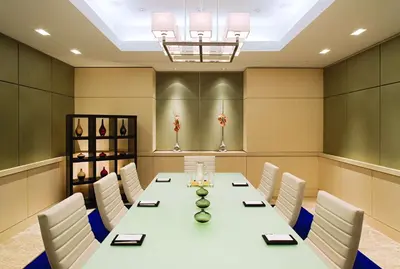 a conference room with a long table and white chairs at Hyatt Regency New Brunswick in New Brunswick