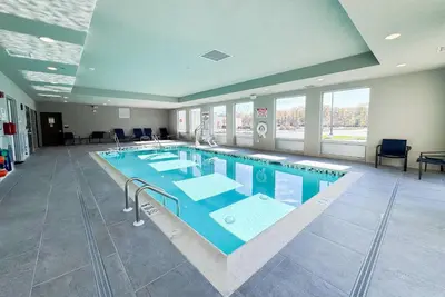 a large swimming pool in a large building at Hawthorn Extended Stay by Wyndham Mount Laurel Moorestown in Mount Laurel