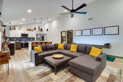 a living room with a couch and a table at Walk to Water Park Split-Rock Resort Home with Deck in Lake Harmony