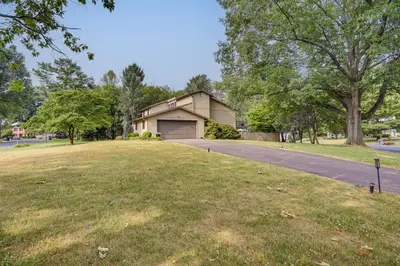 a house with a driveway in front of a yard at 3 Mi to Downtown Inviting Lancaster Home! in Lancaster