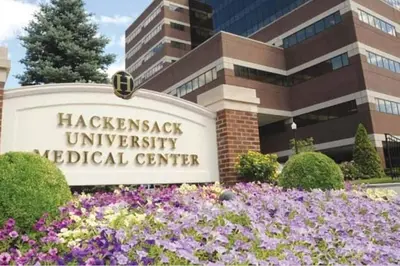 a sign in front of a hospital with flowers at RentalsOP NJ01 Full house minutes from NYC, near to metlife, American Dream in Hackensack