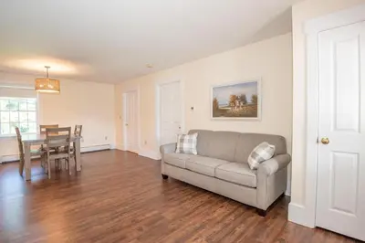 a living room with a couch and a table at Dutch Country Acres in New Providence