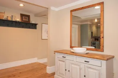 a bathroom with a sink and a mirror at Dutch Country Acres in New Providence