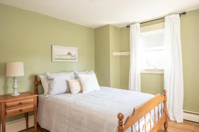 a bedroom with a bed and a window at Dutch Country Acres in New Providence