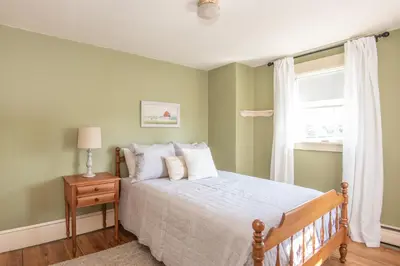 a bedroom with a bed and a window at Dutch Country Acres in New Providence